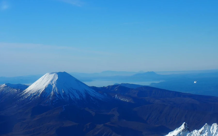 The dark volcanic cone of Mount Doom in Tongariro National Park from above